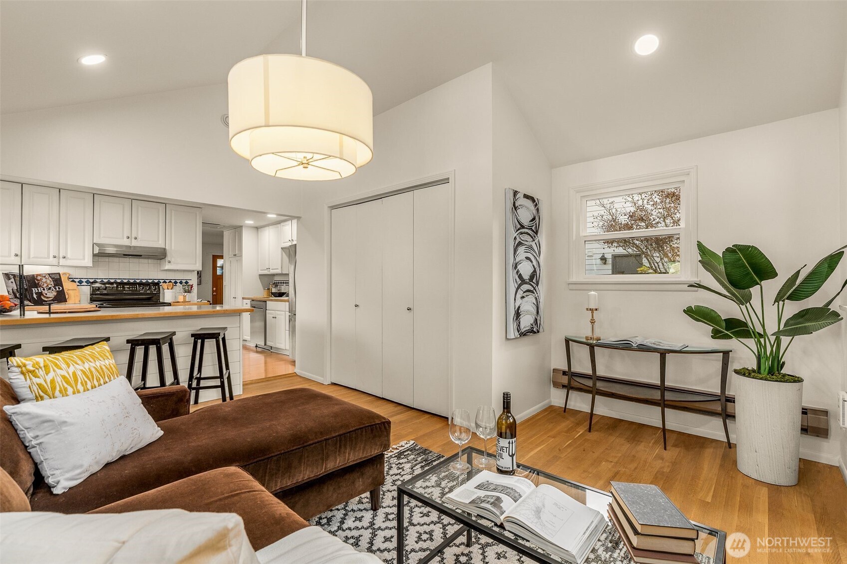5143 46th Avenue Northeast Seattle, WA 98105 - Photo 13 of 33 a living room with furniture kitchen view and a potted plant