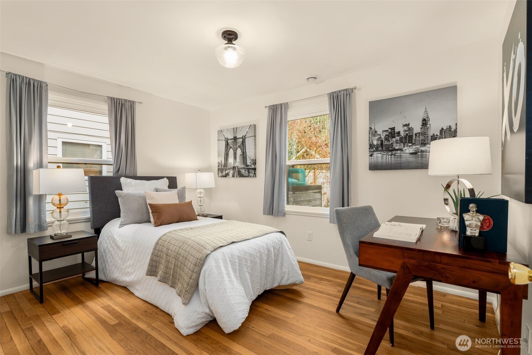 5143 46th Avenue Northeast Seattle, WA 98105 - Photo 16 of 33 a bedroom with a bed and a table in it
