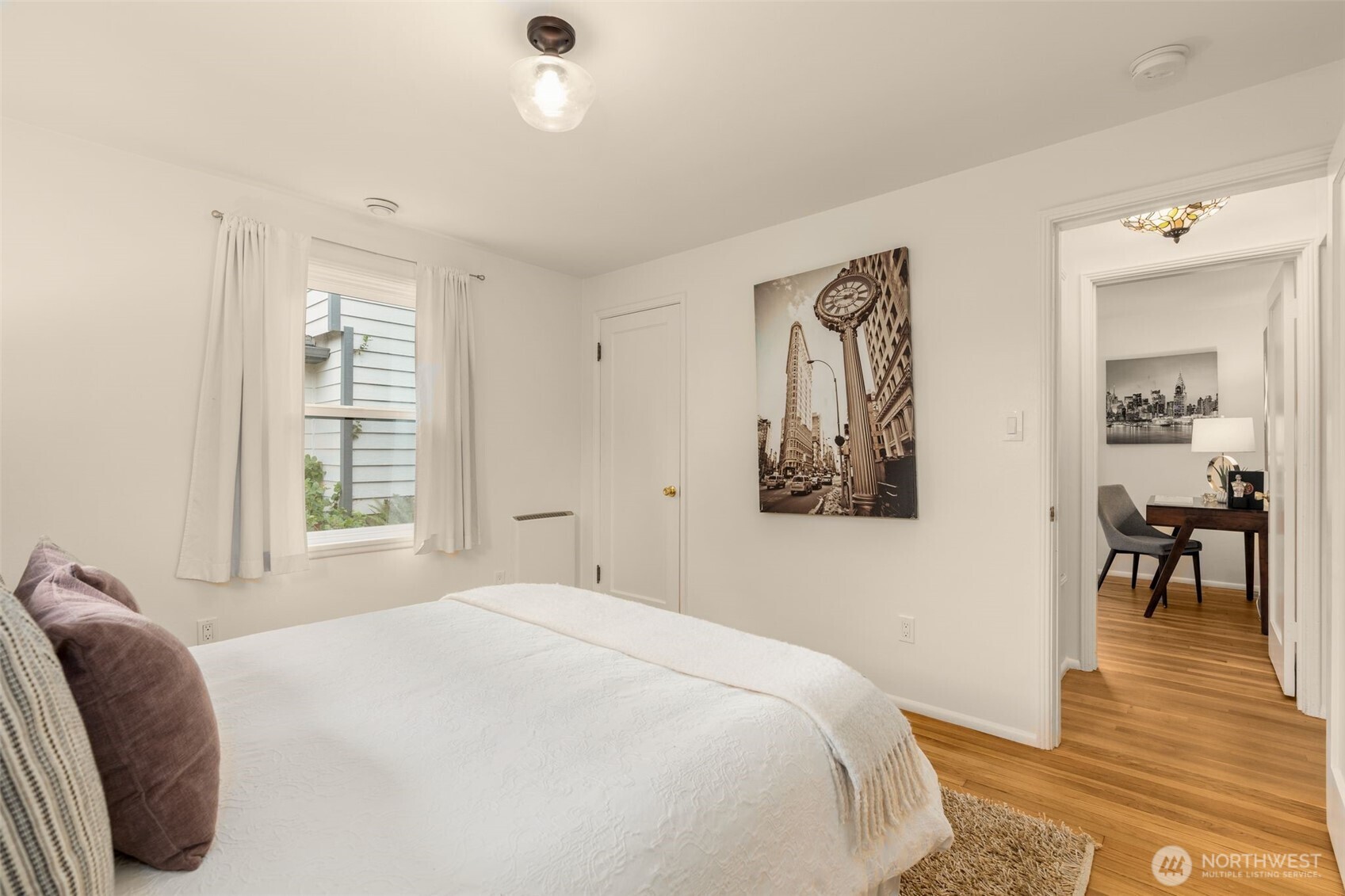 5143 46th Avenue Northeast Seattle, WA 98105 - Photo 18 of 33 a bedroom with a bed and a painting on the wall