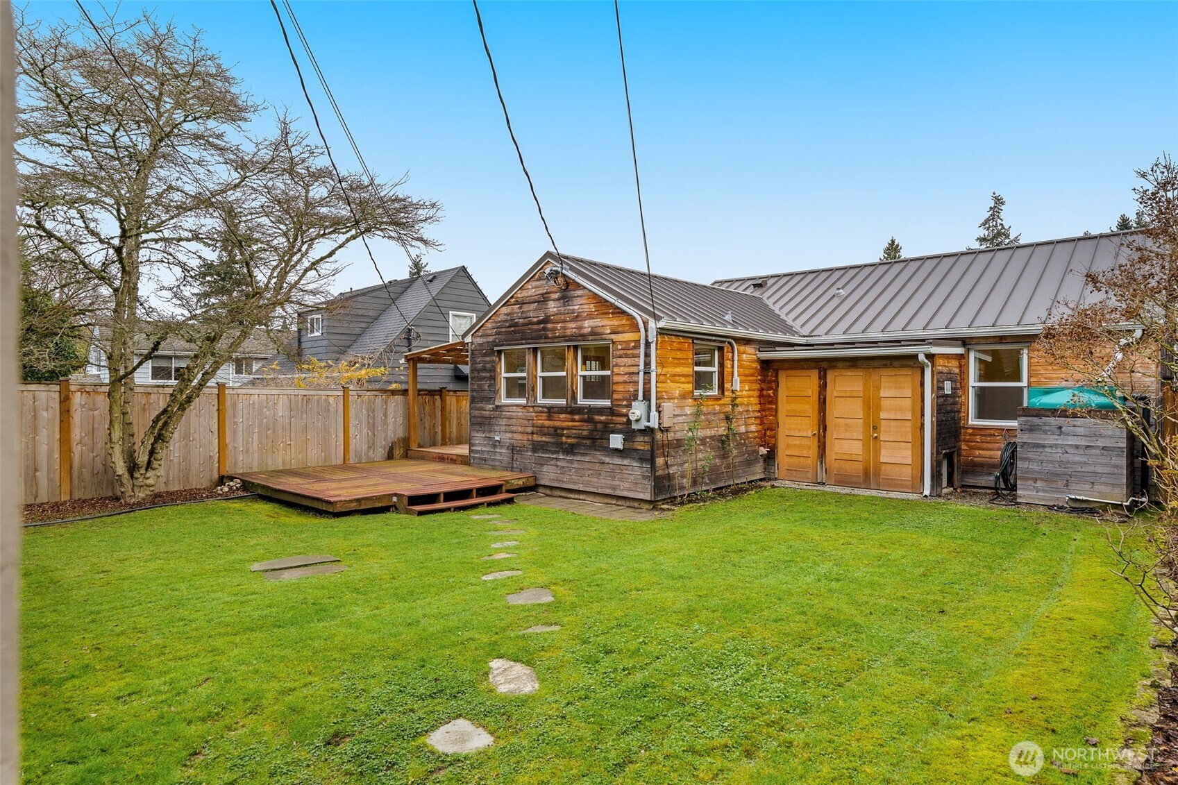 5143 46th Avenue Northeast Seattle, WA 98105 - Photo 24 of 33 a view of a house with a yard and sitting area
