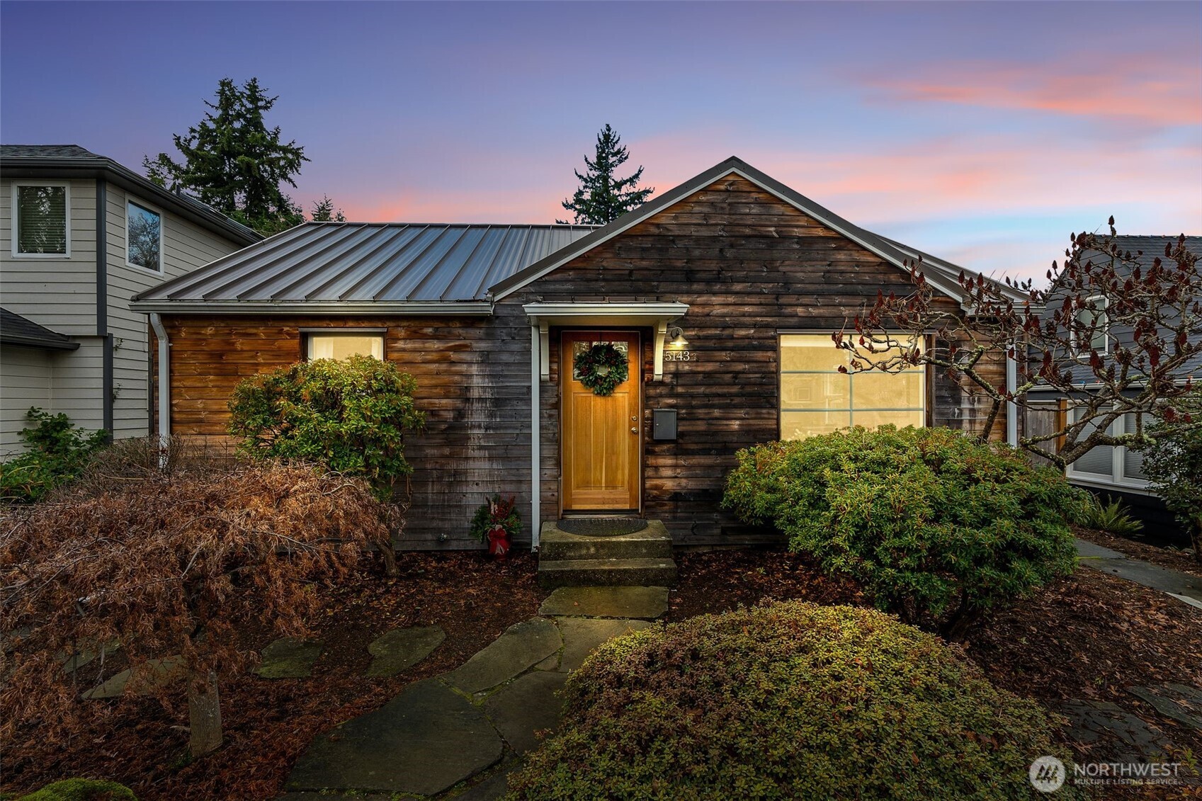 5143 46th Avenue Northeast Seattle, WA 98105 - Photo 30 of 33 a front view of a house with garden