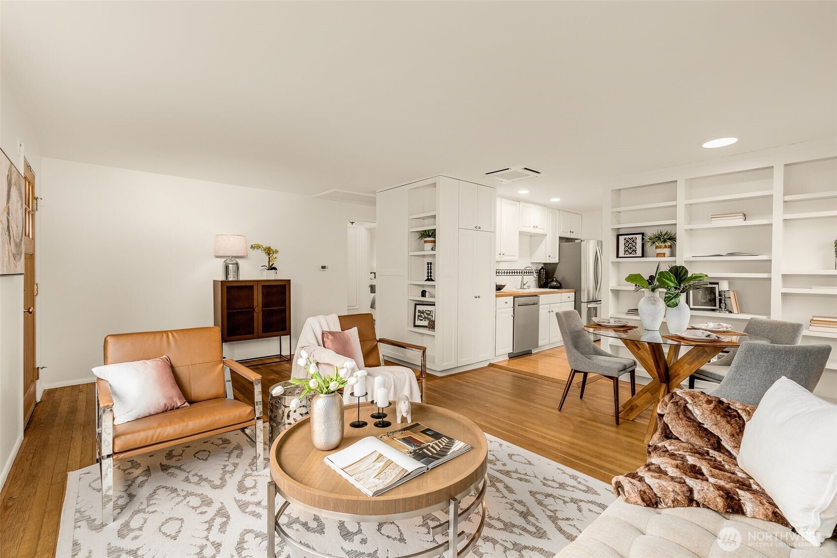 5143 46th Avenue Northeast Seattle, WA 98105 - Photo 7 of 33 a living room with furniture a dining table and kitchen view