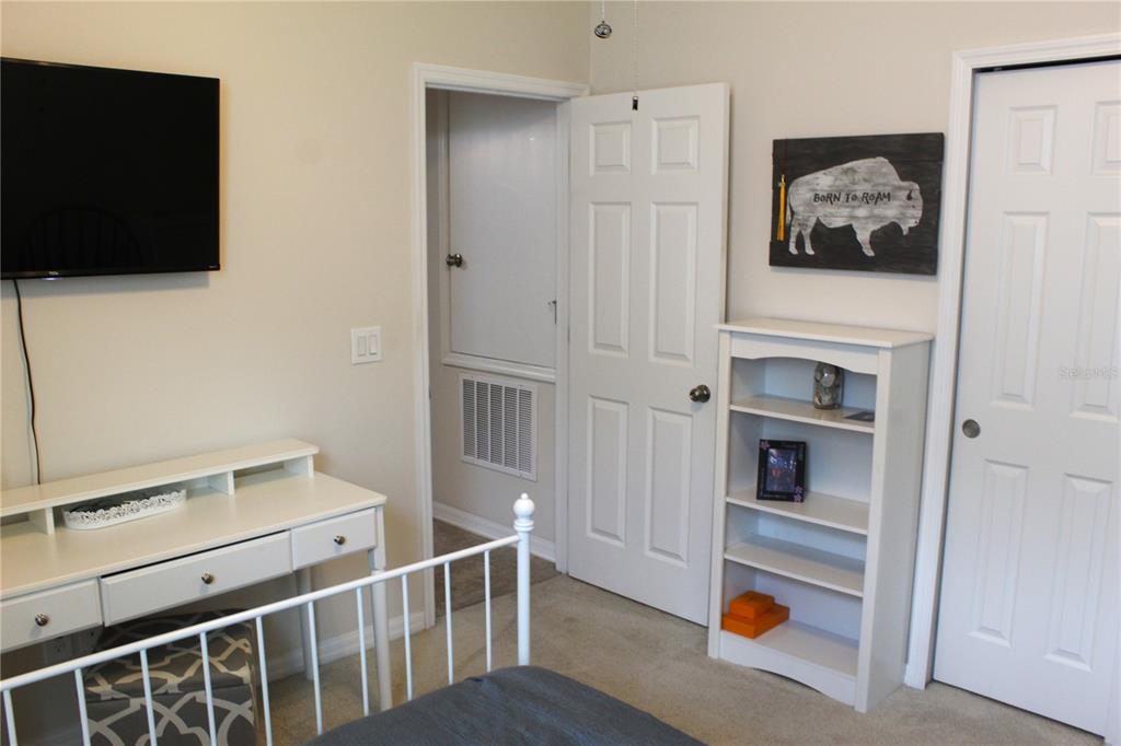 4110 Arlington Ridge Boulevard Leesburg, FL 34748 - Photo 14 of 33 a view of an empty room with wooden floor and a window