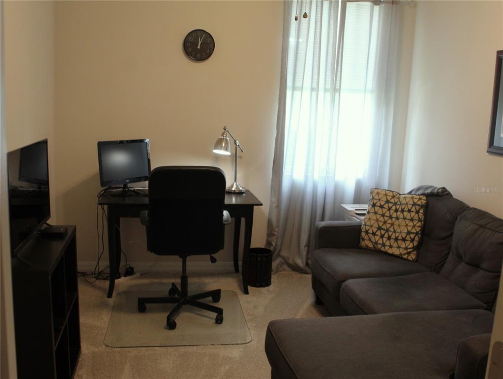 4110 Arlington Ridge Boulevard Leesburg, FL 34748 - Photo 17 of 33 a living room with furniture and a window