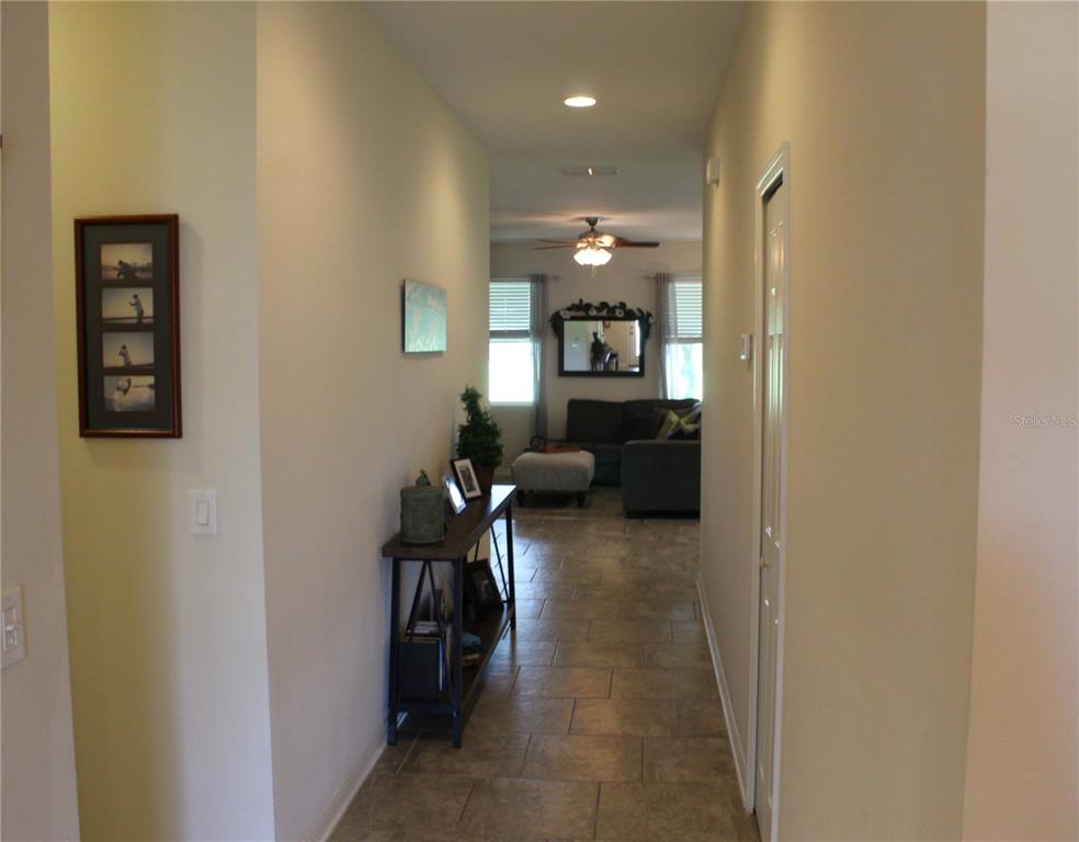 4110 Arlington Ridge Boulevard Leesburg, FL 34748 - Photo 2 of 33 a view of a hallway with workspace and a window