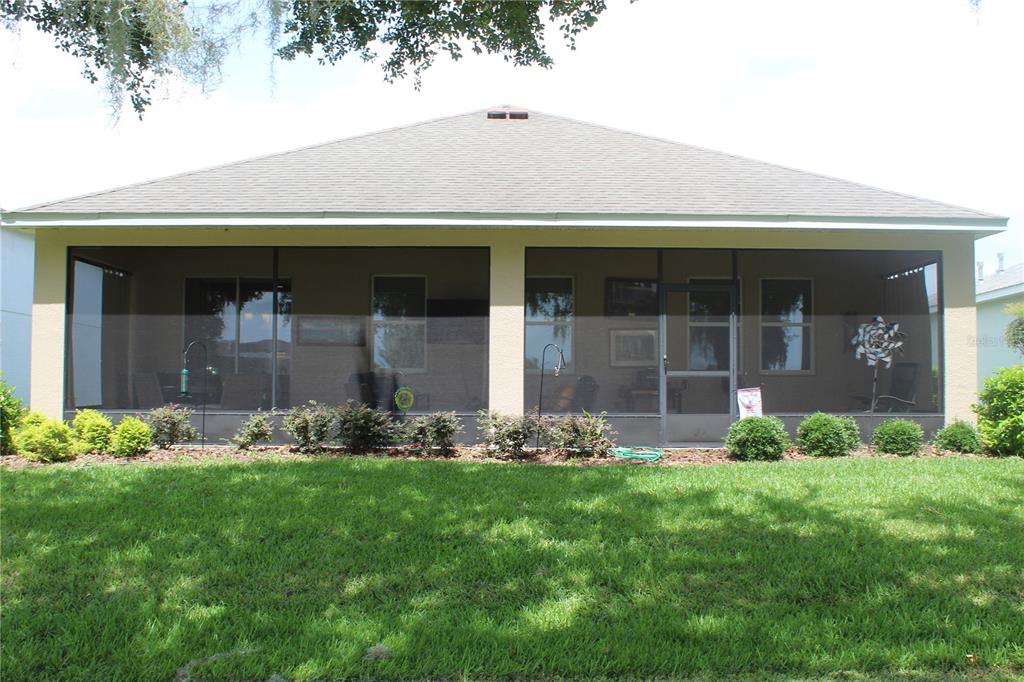 4110 Arlington Ridge Boulevard Leesburg, FL 34748 - Photo 24 of 33 a front view of a house with garden