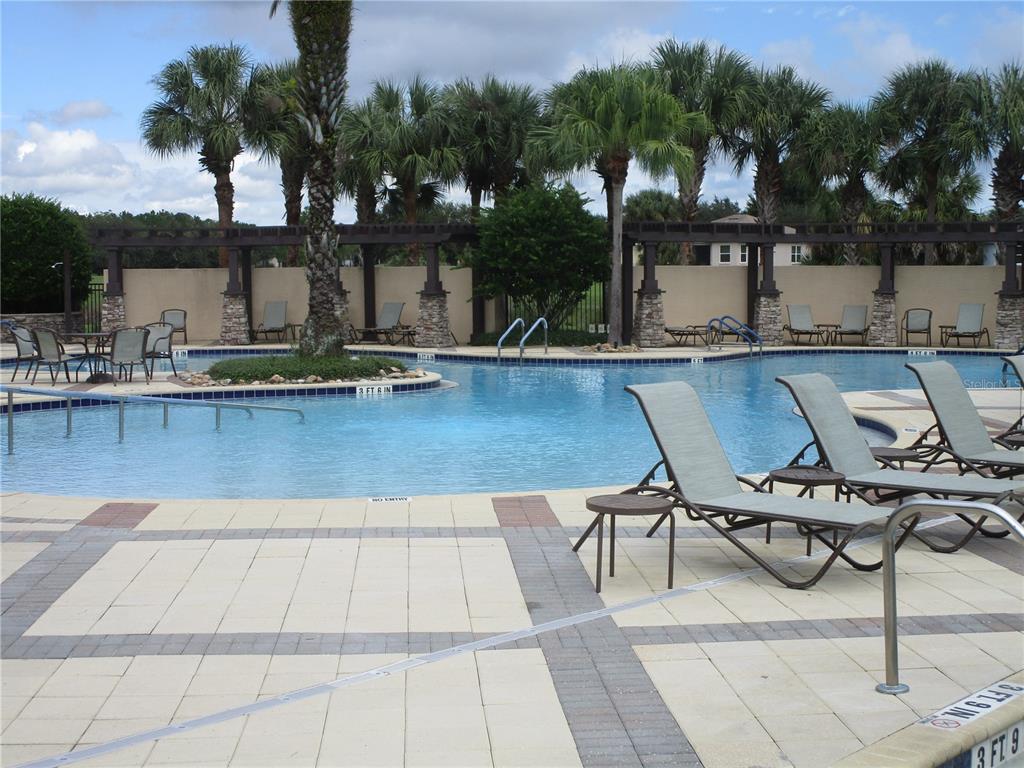 4110 Arlington Ridge Boulevard Leesburg, FL 34748 - Photo 31 of 33 a view of a swimming pool with lounge chairs