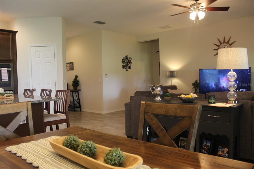 4110 Arlington Ridge Boulevard Leesburg, FL 34748 - Photo 8 of 33 a living room with furniture and a rug