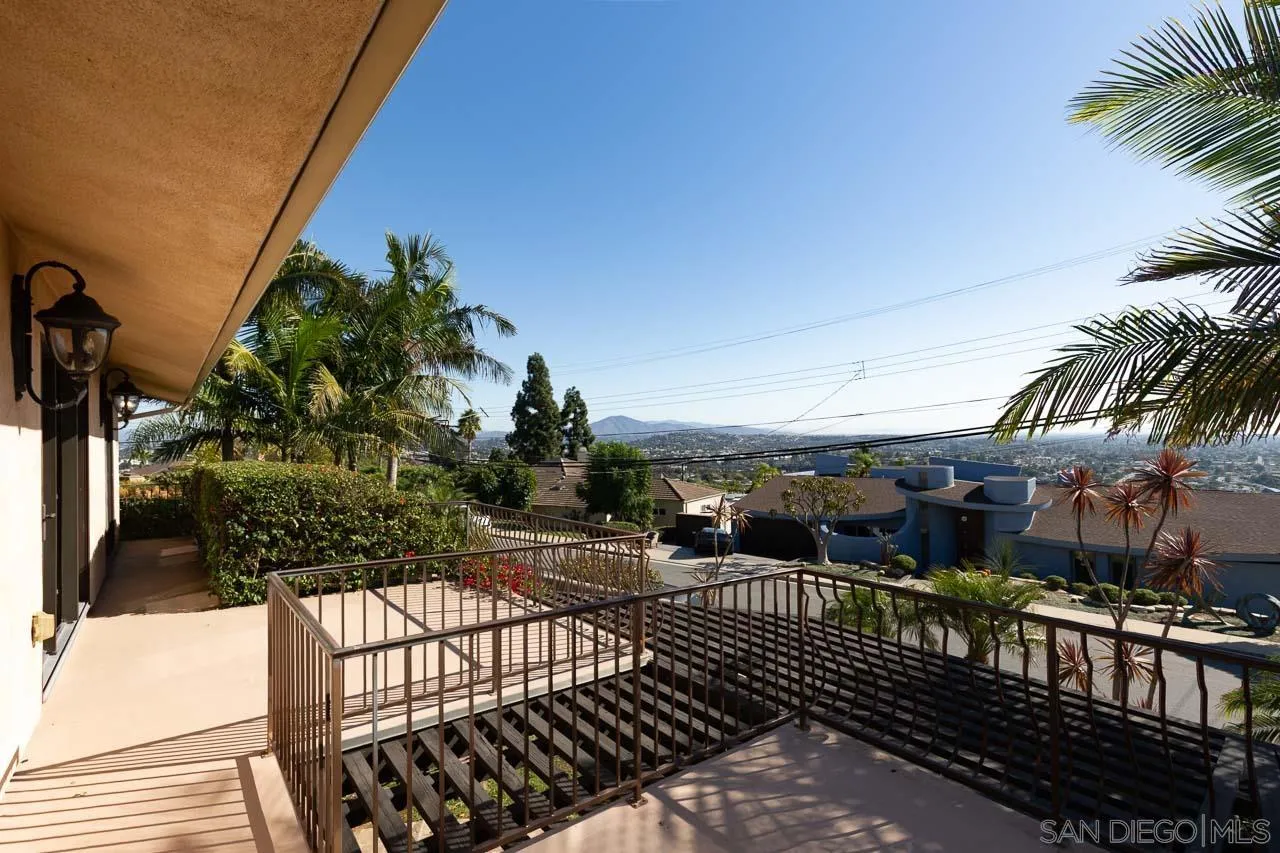 6724 Dwane Avenue San Diego, CA 92120 - Photo 24 of 38 a view of a balcony with a potted plants