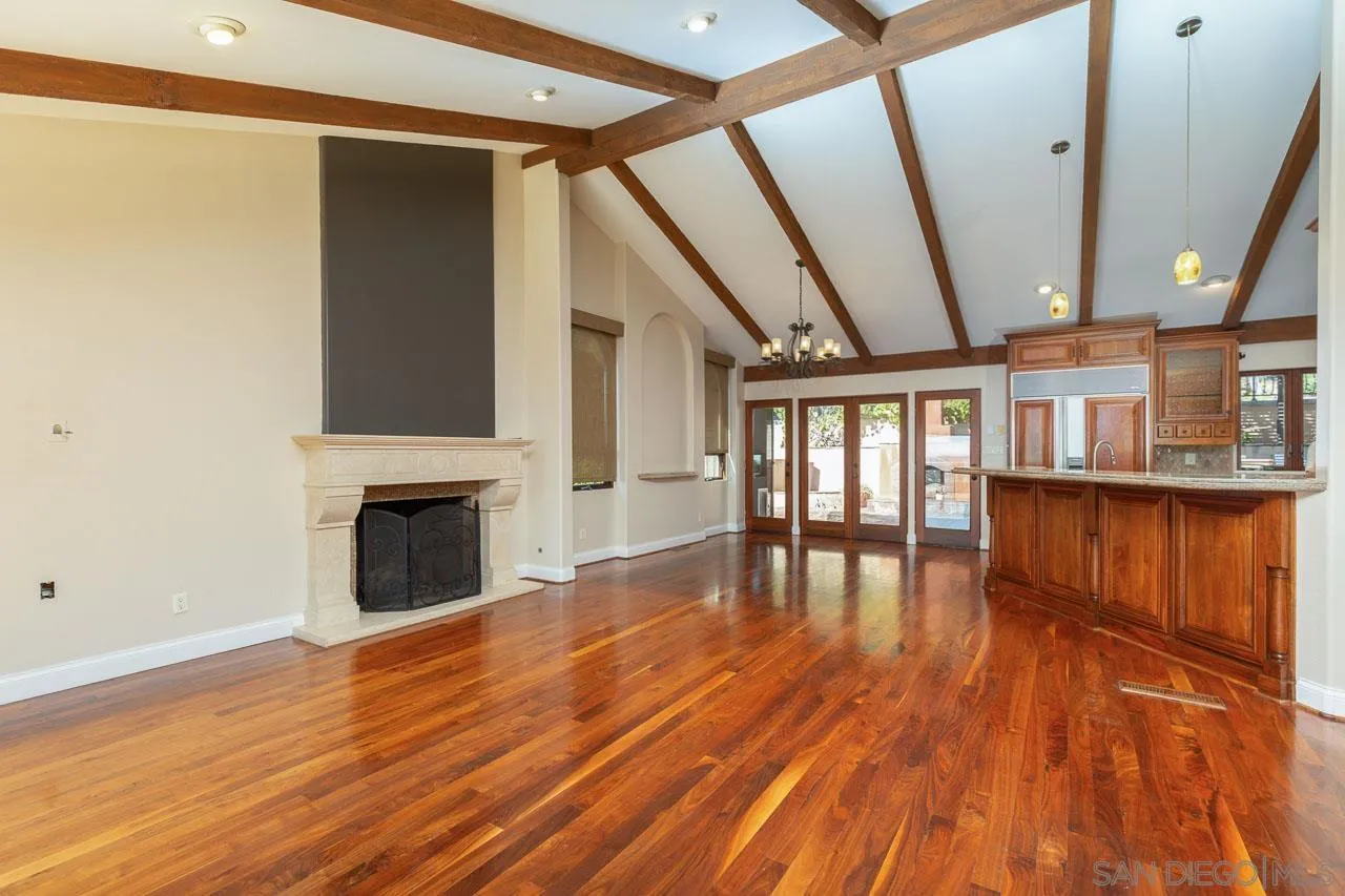 6724 Dwane Avenue San Diego, CA 92120 - Photo 6 of 38 a view of empty room with wooden floor and fan