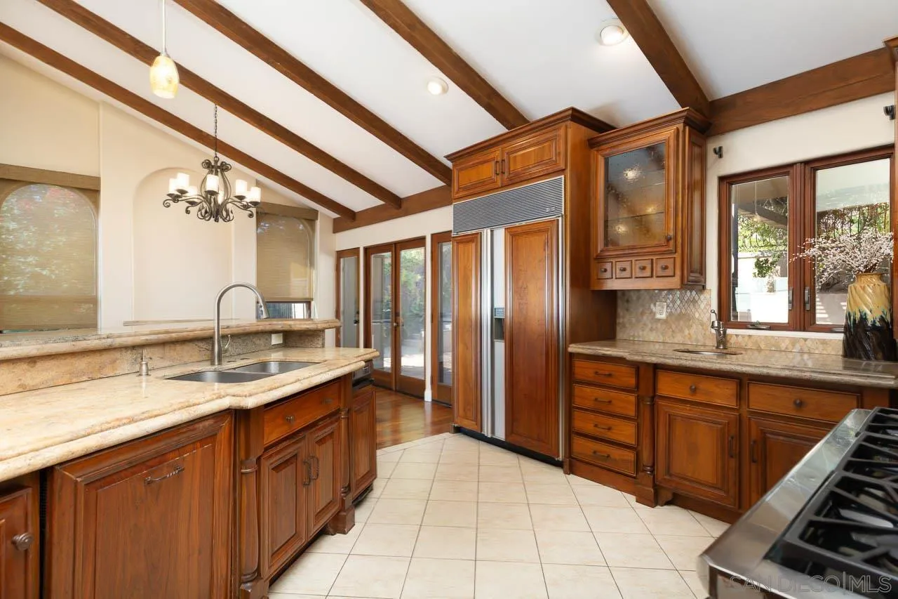 6724 Dwane Avenue San Diego, CA 92120 - Photo 10 of 38 a spacious bathroom with a granite countertop sink a mirror and a bathtub