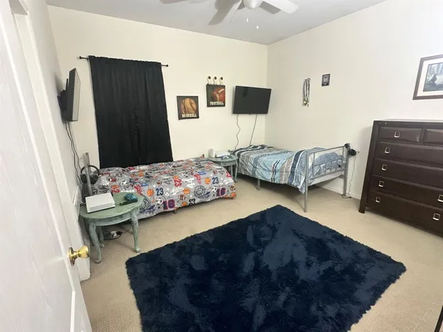 a bedroom with a bed and a couch