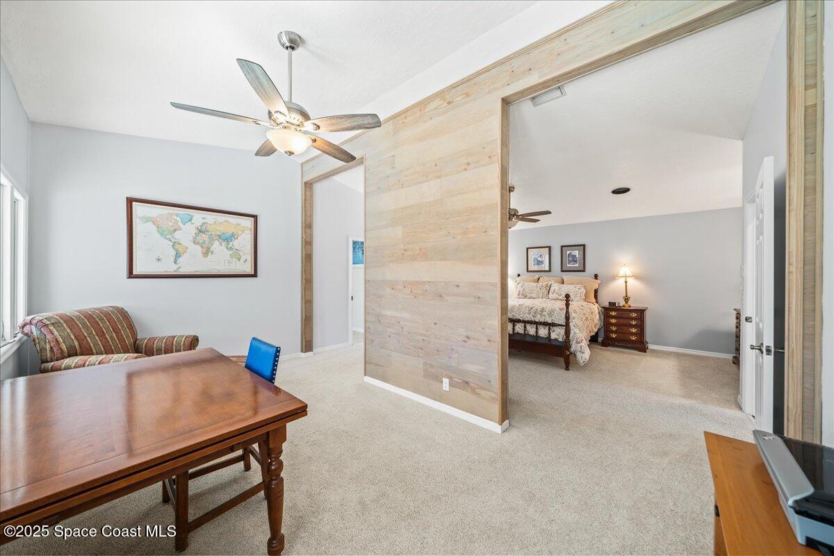 3651 Big Pine Road Melbourne, FL 32934 - Photo 18 of 32 a living room with furniture and a table