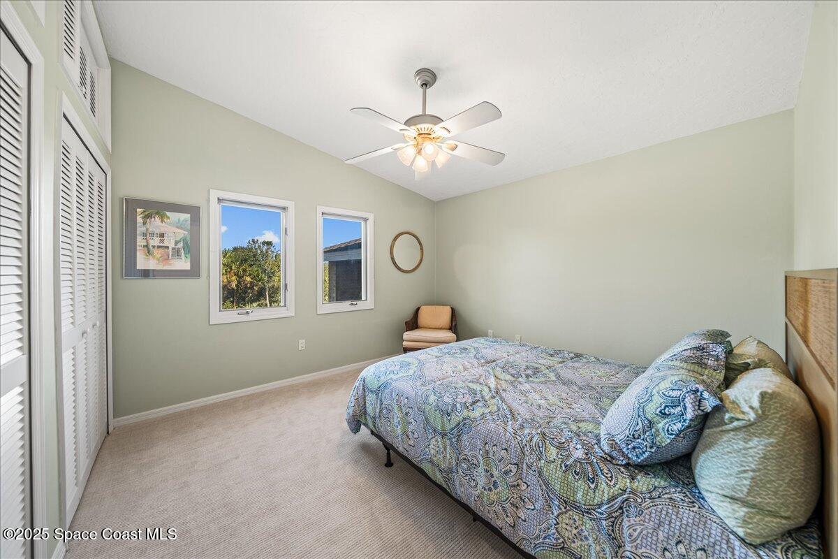 3651 Big Pine Road Melbourne, FL 32934 - Photo 22 of 32 a bedroom with bed and a window