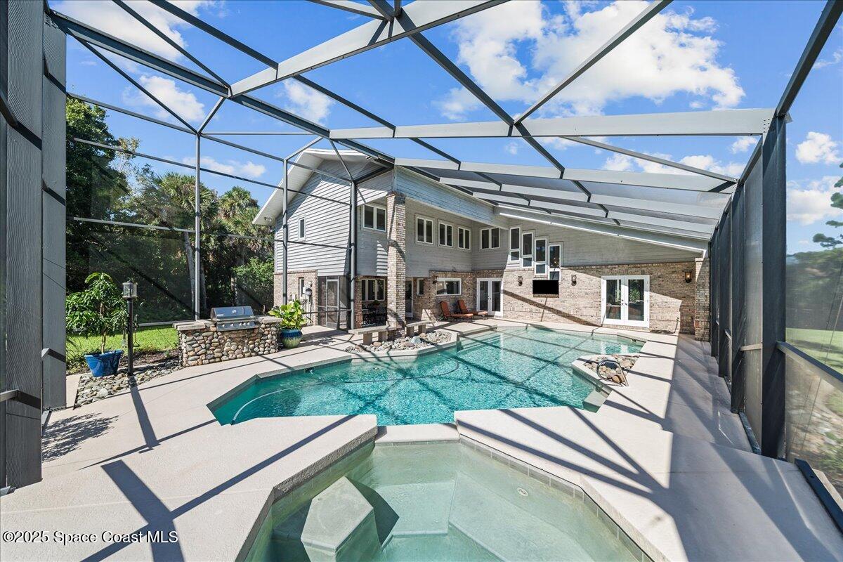 3651 Big Pine Road Melbourne, FL 32934 - Photo 26 of 32 a view of a backyard with couches chair and wooden floor