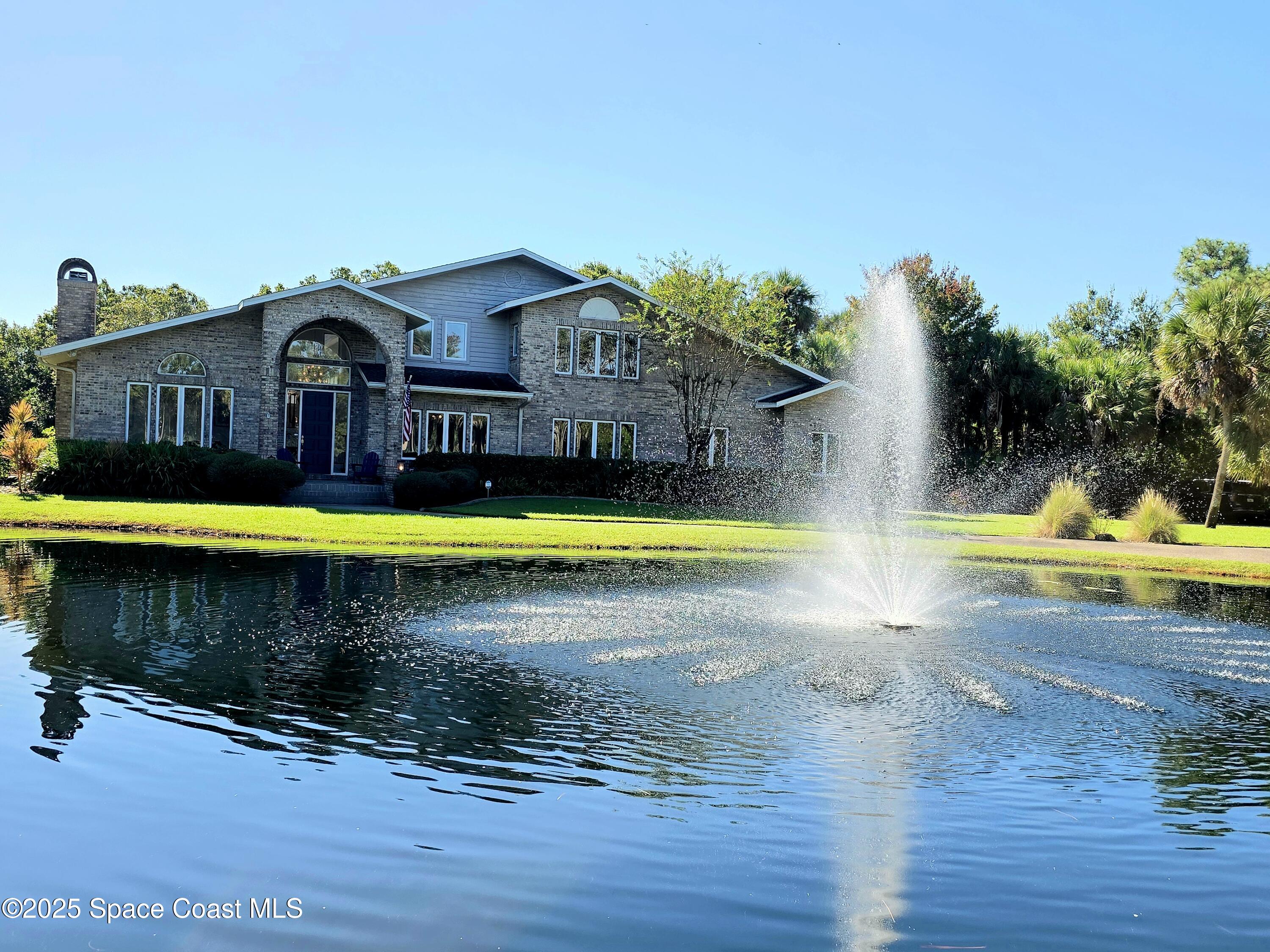 3651 Big Pine Road Melbourne, FL 32934 - Photo 30 of 32 a view of swimming pool with lawn chairs and plants