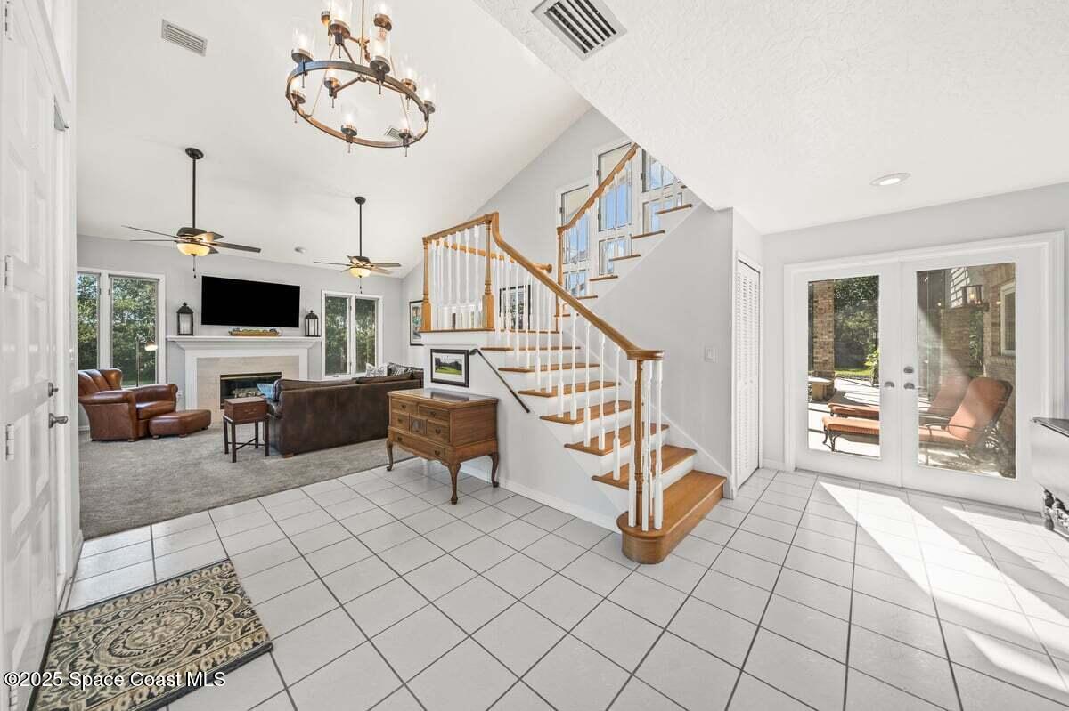 3651 Big Pine Road Melbourne, FL 32934 - Photo 5 of 32 a view of a livingroom with furniture and a flat screen tv