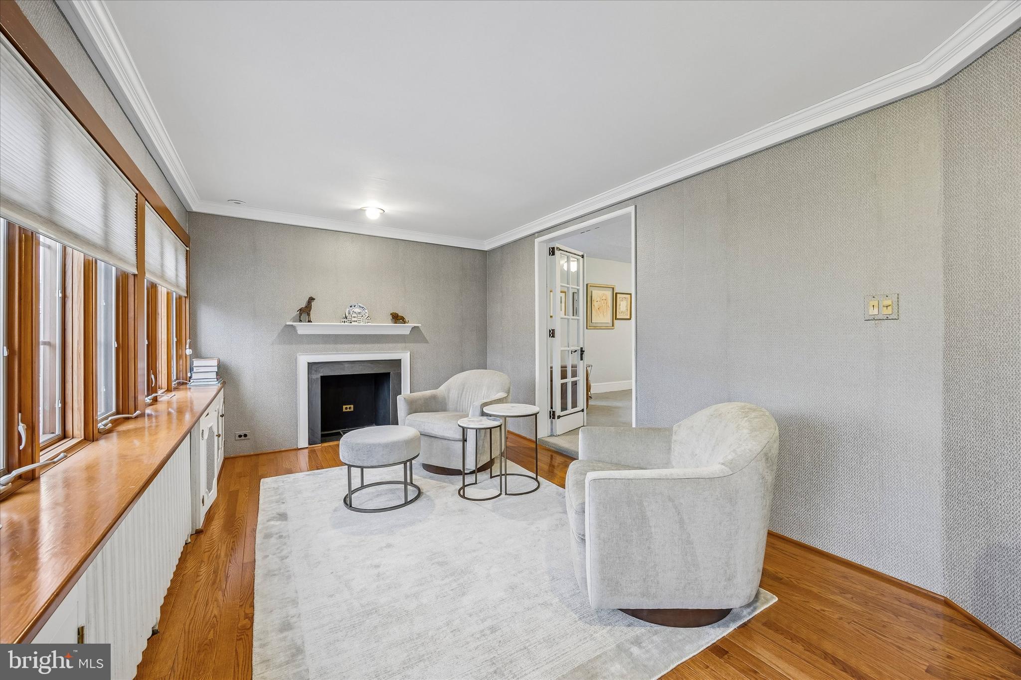 239 Winding Way Merion Station, PA 19066 - Photo 23 of 48 a living room with furniture a fireplace and a large window
