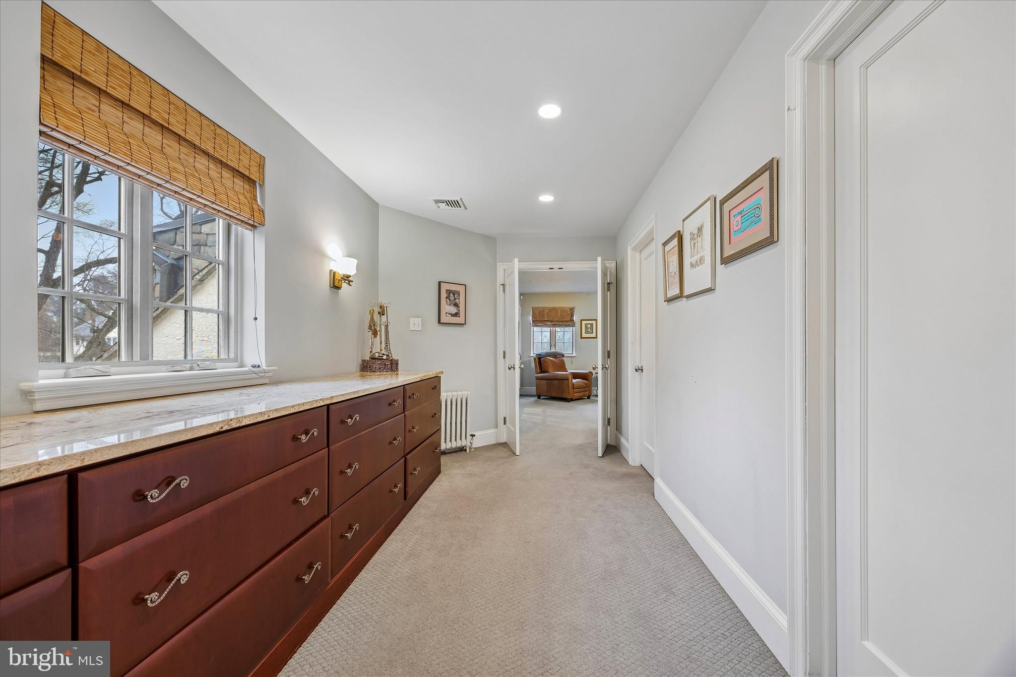 239 Winding Way Merion Station, PA 19066 - Photo 26 of 48 a spacious bathroom with a granite countertop sink mirror and a bathtub