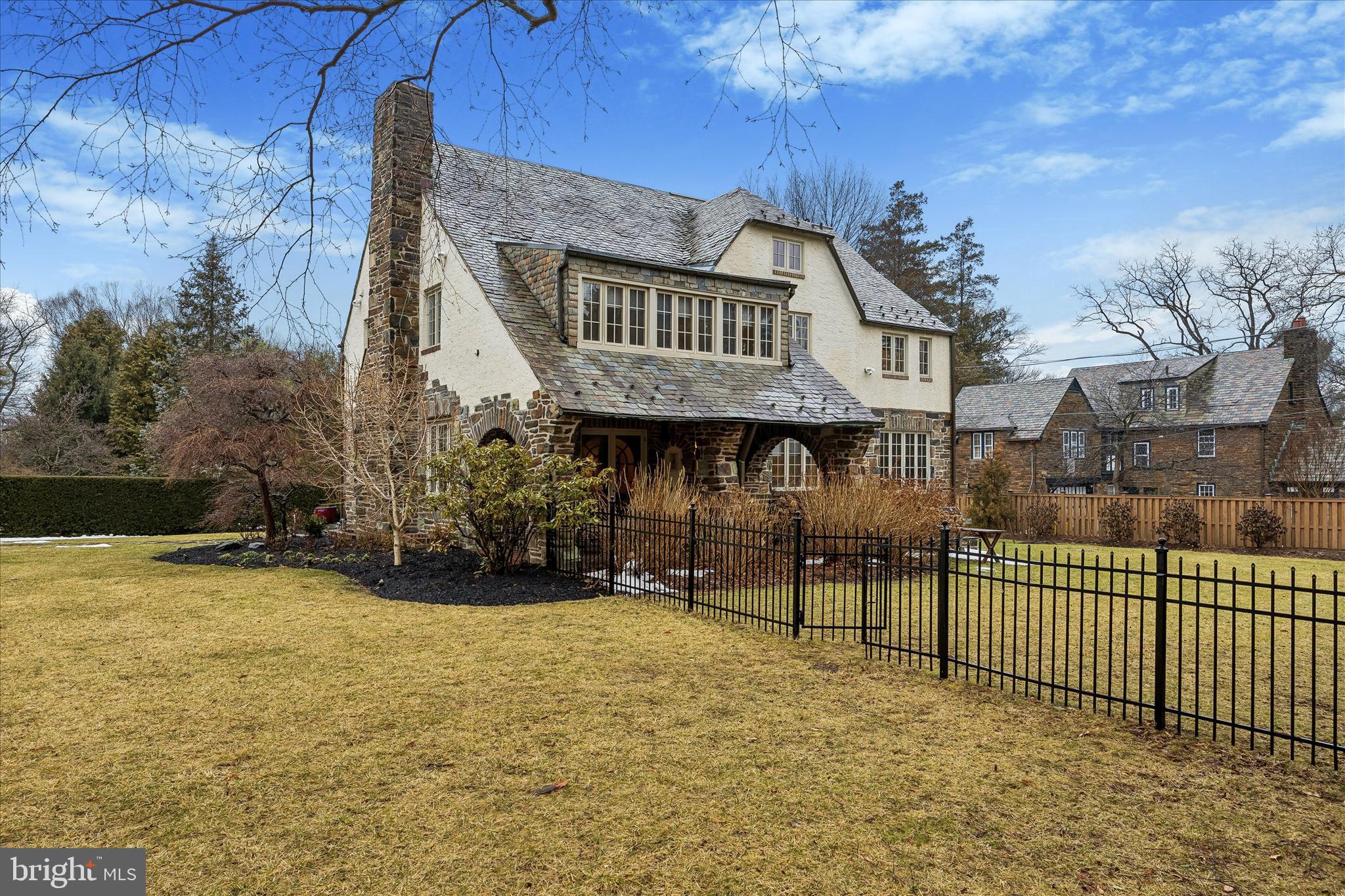 239 Winding Way Merion Station, PA 19066 - Photo 48 of 48 a view of a brick house with many windows