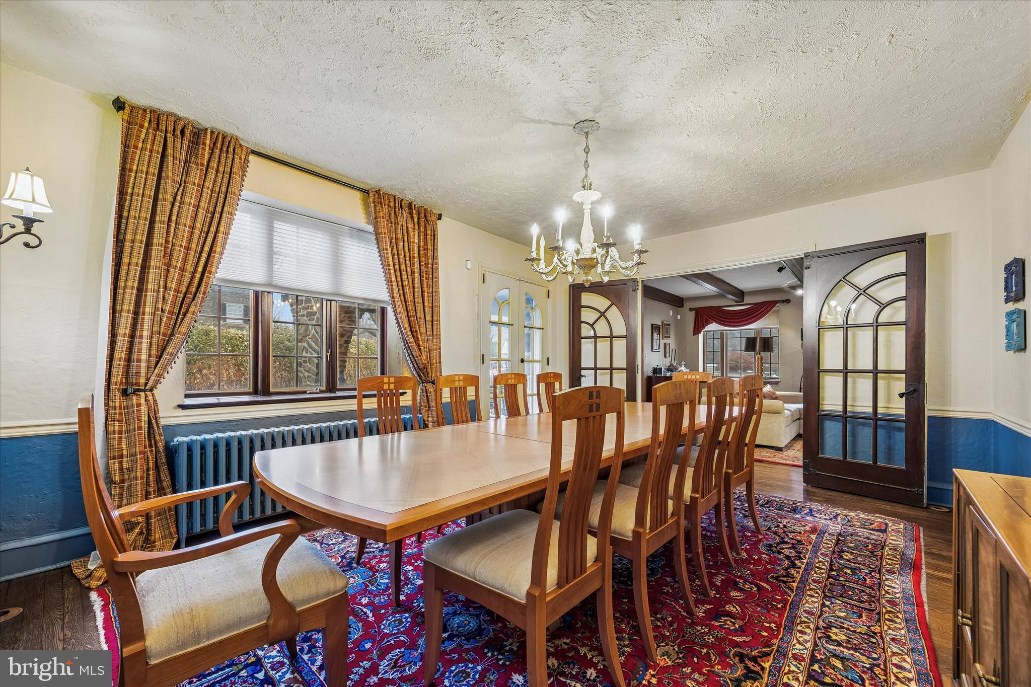 239 Winding Way Merion Station, PA 19066 - Photo 9 of 48 a view of a dining room with furniture a chandelier and wooden floor
