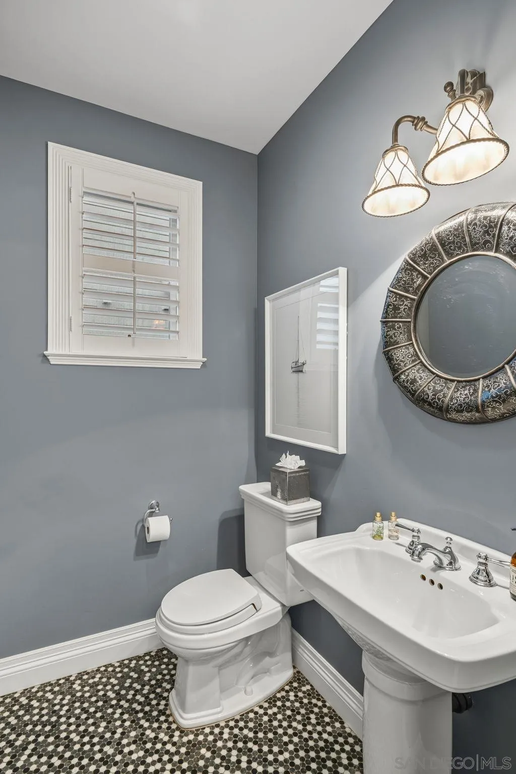 861 B Avenue Coronado, CA 92118 - Photo 13 of 45 a bathroom with a sink a toilet and mirror