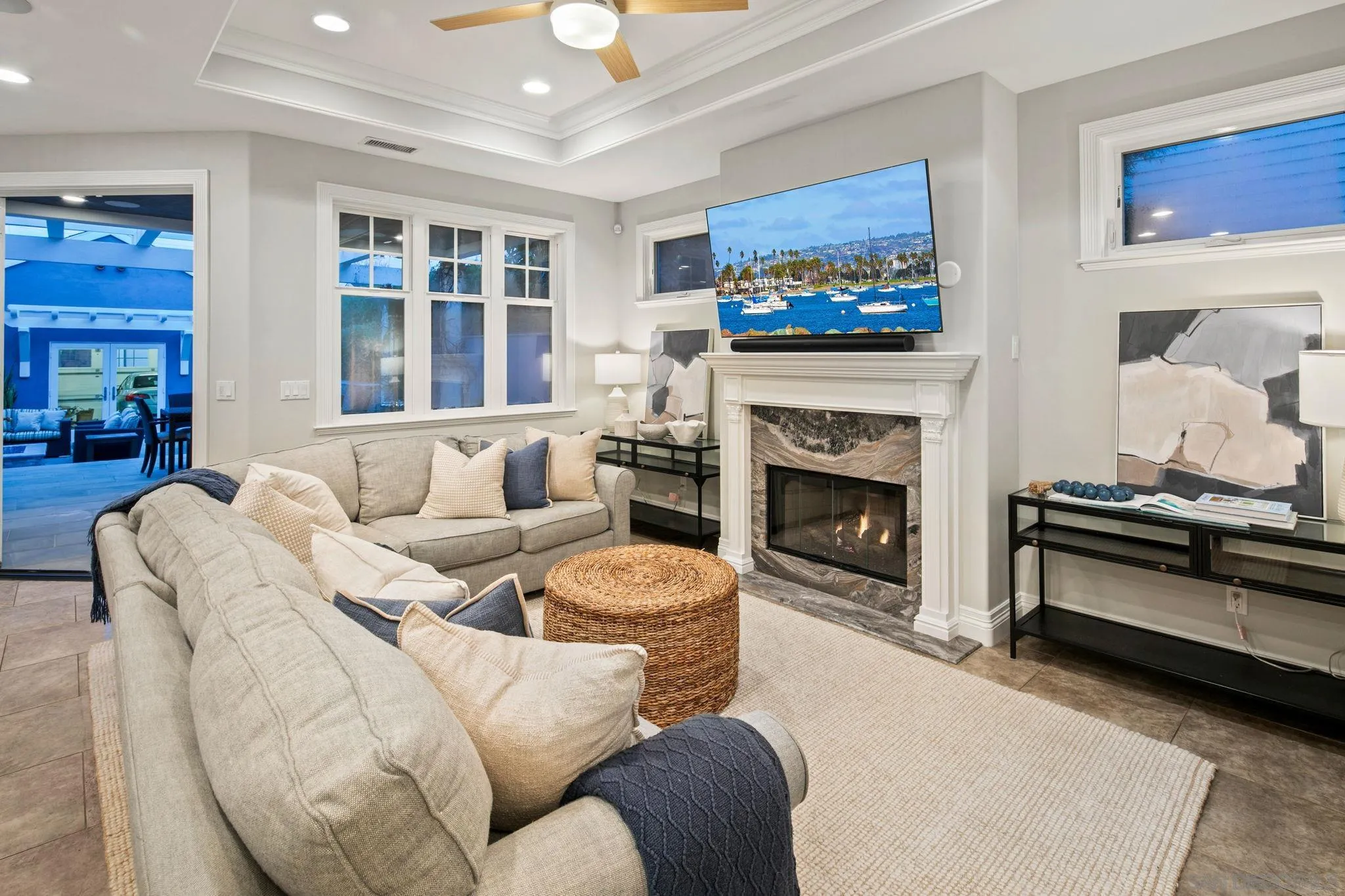 861 B Avenue Coronado, CA 92118 - Photo 16 of 45 a living room with furniture a fireplace and windows