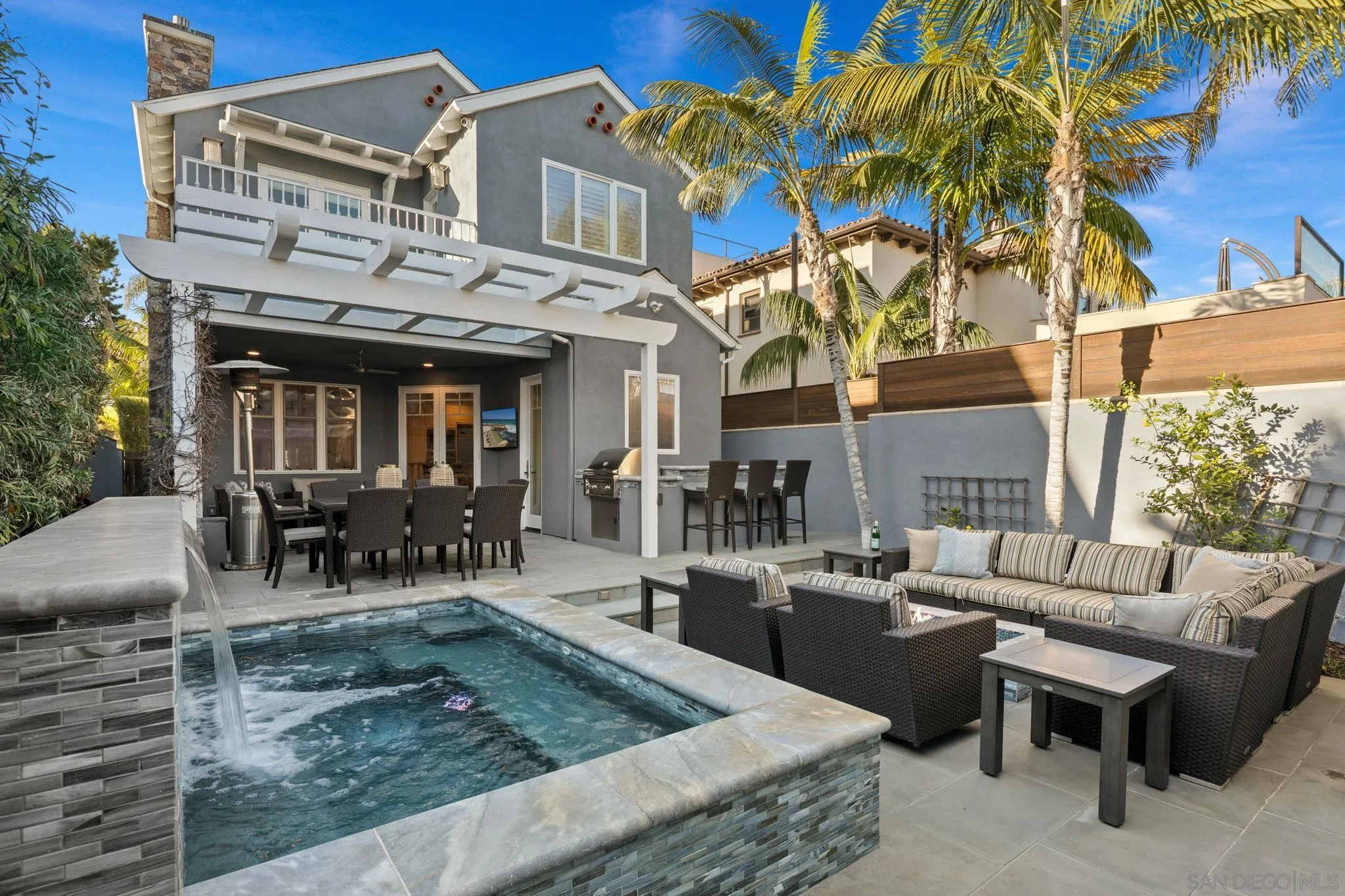 861 B Avenue Coronado, CA 92118 - Photo 21 of 45 a view of a patio with couches table and chairs and potted plants