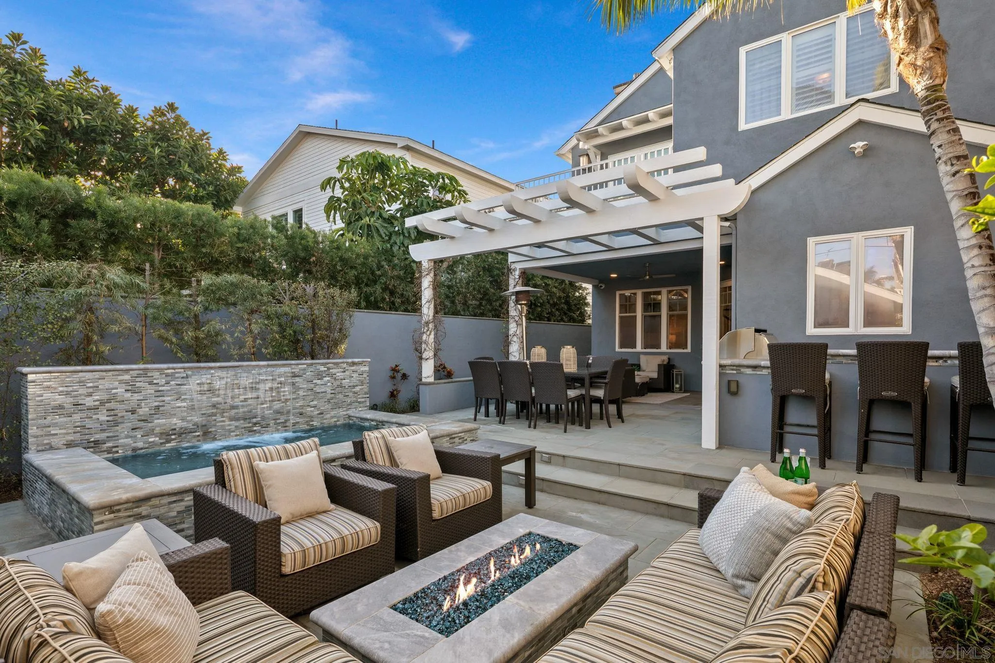 861 B Avenue Coronado, CA 92118 - Photo 23 of 45 a view of a patio with couches and a table and chairs with wooden floor