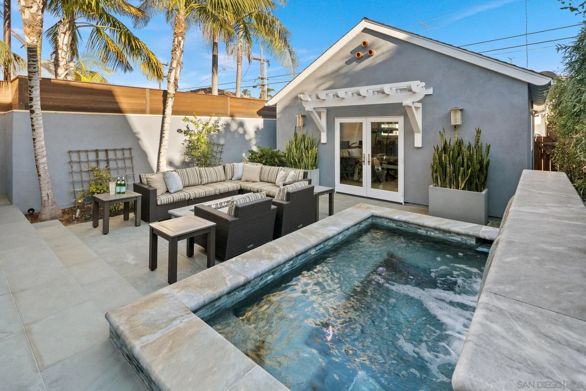 861 B Avenue Coronado, CA 92118 - Photo 25 of 45 a view of a house with backyard and sitting area