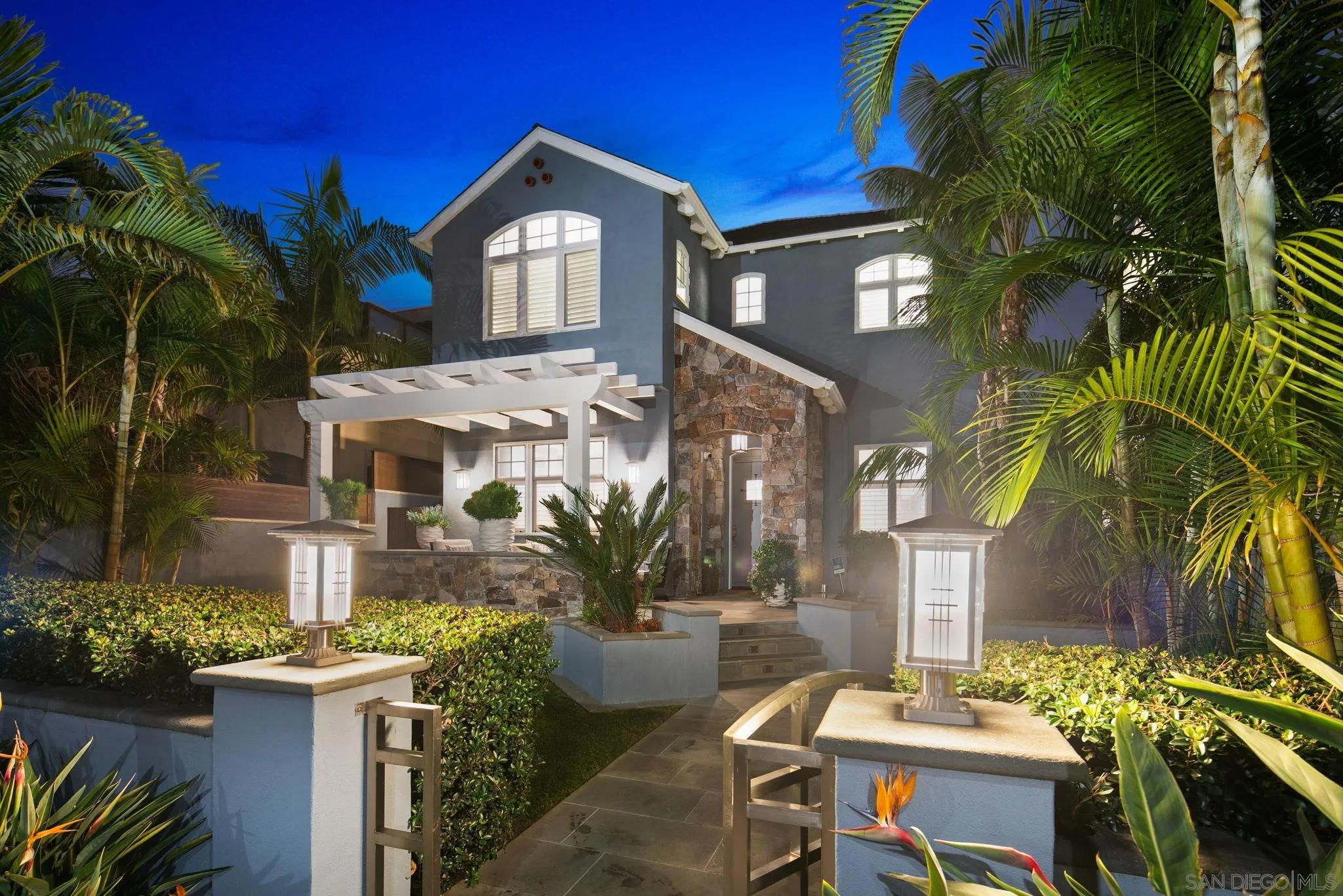 861 B Avenue Coronado, CA 92118 - Photo 3 of 45 a front view of a house with a yard