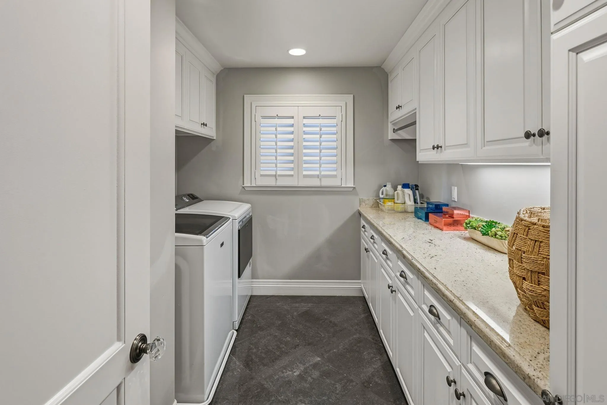 861 B Avenue Coronado, CA 92118 - Photo 35 of 45 a kitchen with a white stove top oven and sink