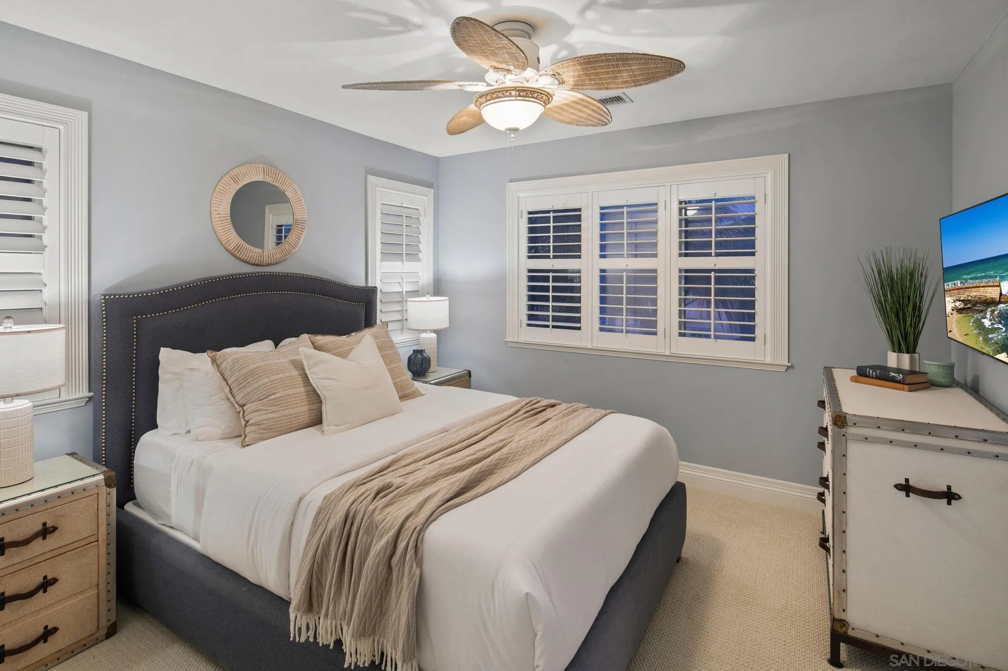 861 B Avenue Coronado, CA 92118 - Photo 38 of 45 a bedroom with a large bed and a window