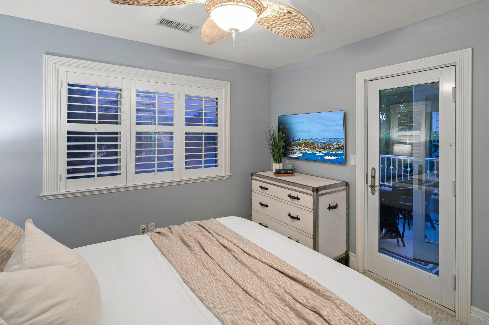 861 B Avenue Coronado, CA 92118 - Photo 39 of 45 a bedroom with a bed and a window