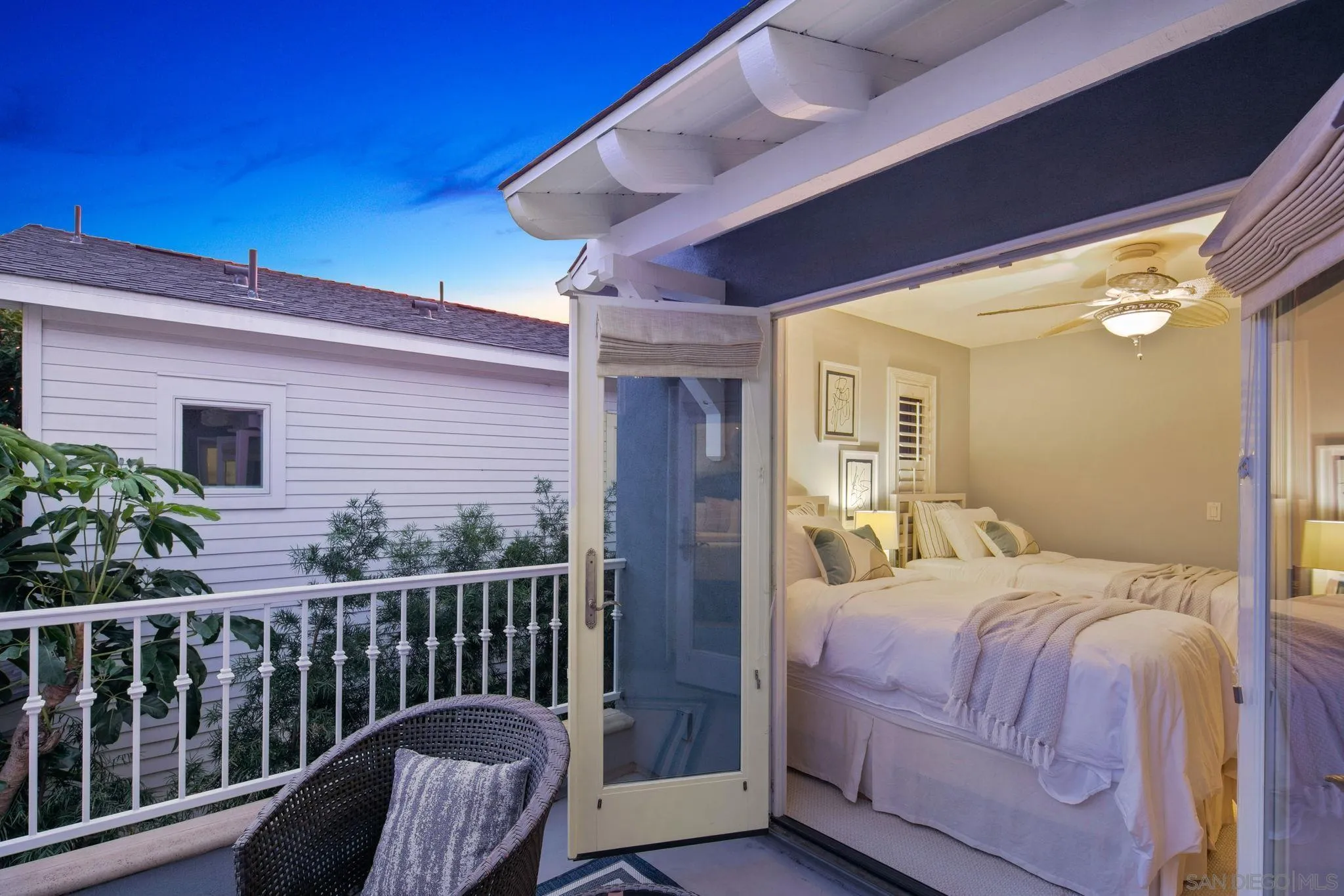 861 B Avenue Coronado, CA 92118 - Photo 41 of 45 a bedroom with a bed and wooden floor