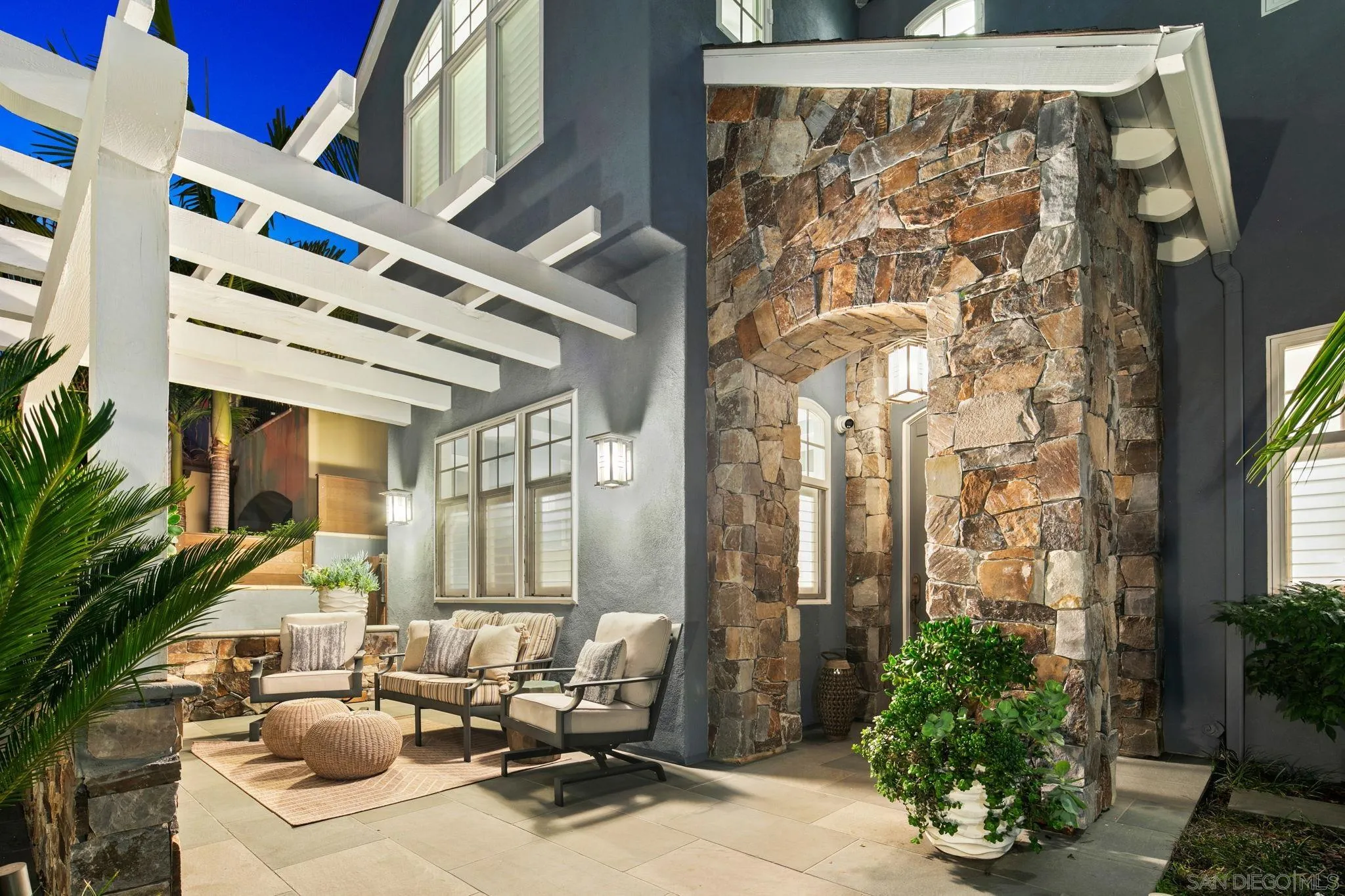 861 B Avenue Coronado, CA 92118 - Photo 6 of 45 a building outdoor space with patio furniture and potted plants