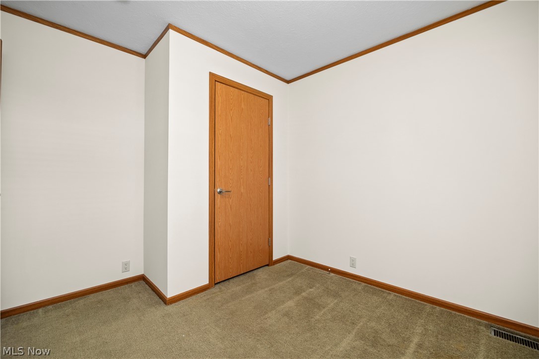 35157 Center Ridge Road, Unit 92 North Ridgeville, OH 44039 - Photo 23 of 40 Neutral wall paint with wood trim accents