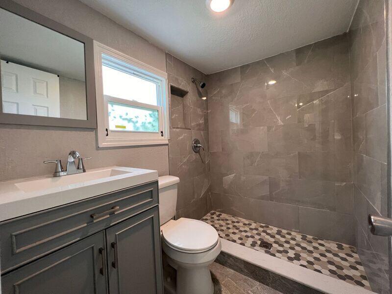 718 West 7th Street, Unit 2 Riviera Beach, FL 33404 - Photo 16 of 21 a bathroom with a sink toilet and shower