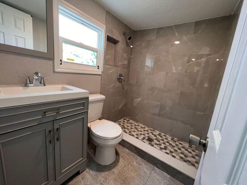 718 West 7th Street, Unit 2 Riviera Beach, FL 33404 - Photo 6 of 21 a bathroom with a sink toilet and shower