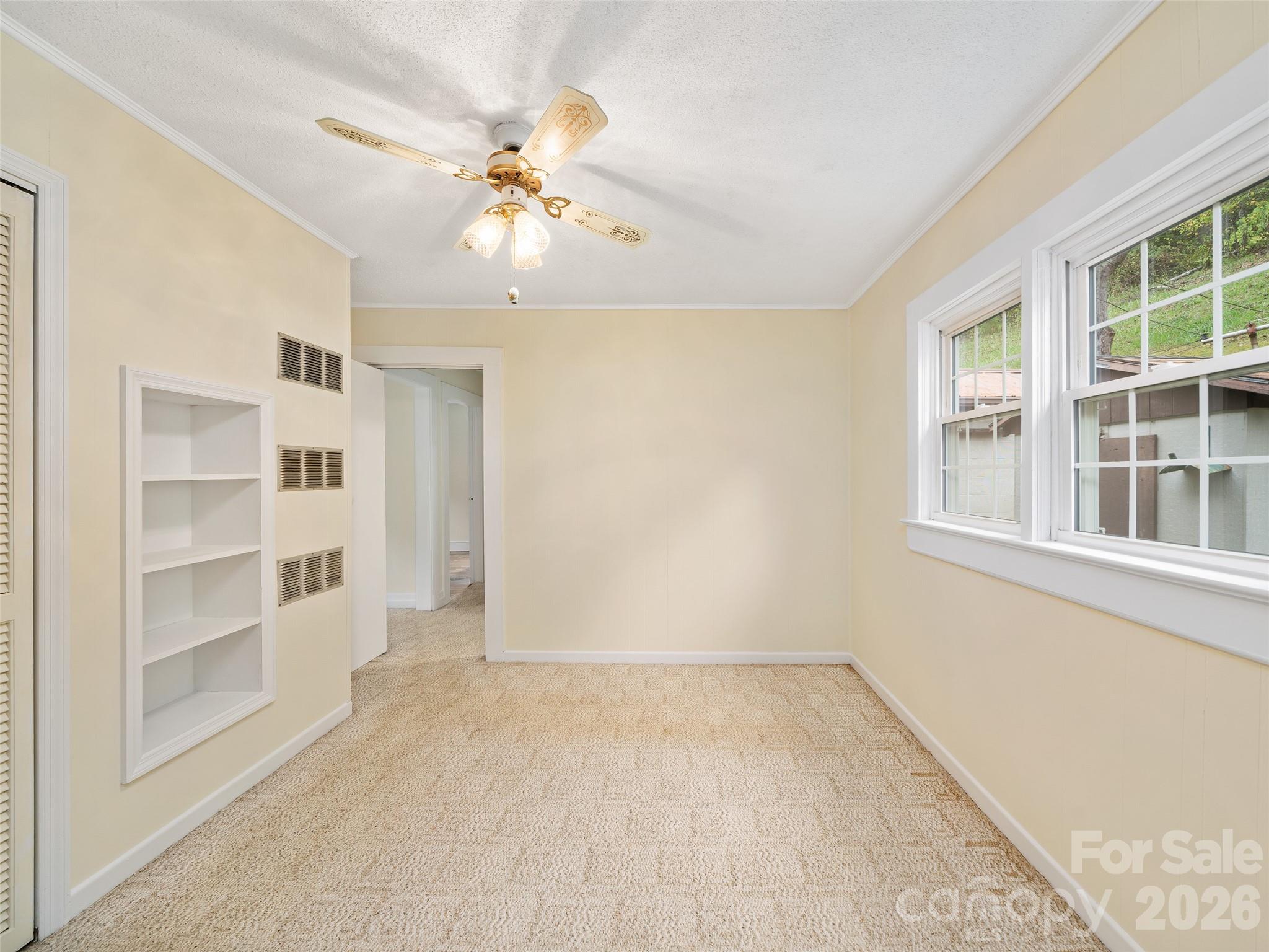 338 Sweet Creek Road Bakersville, NC 28705 - Photo 12 of 21 a view of an empty room with a window
