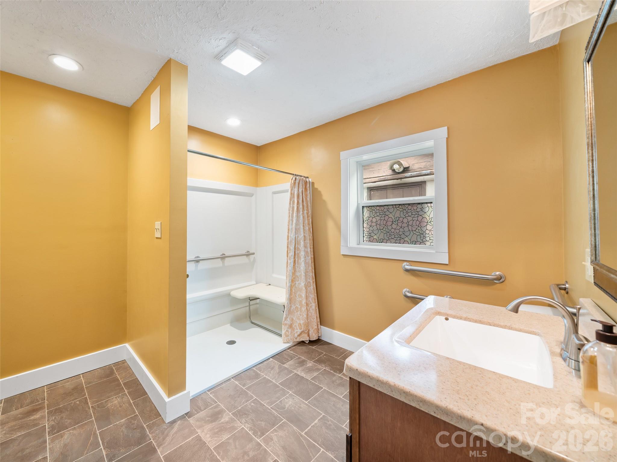 338 Sweet Creek Road Bakersville, NC 28705 - Photo 15 of 21 a bathroom with a sink and a mirror