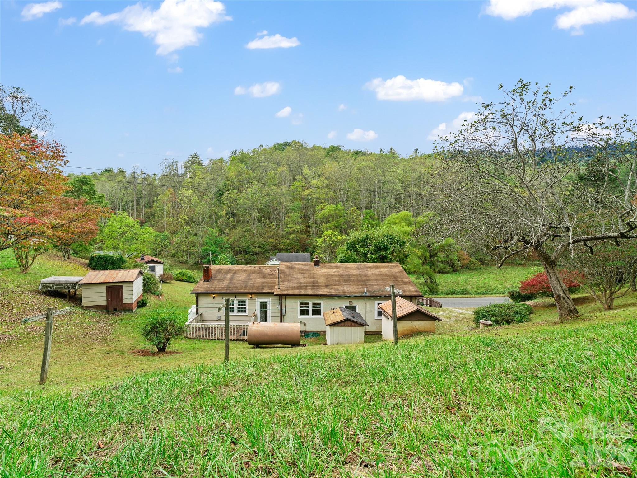 338 Sweet Creek Road Bakersville, NC 28705 - Photo 20 of 21 a view of a house with a big yard