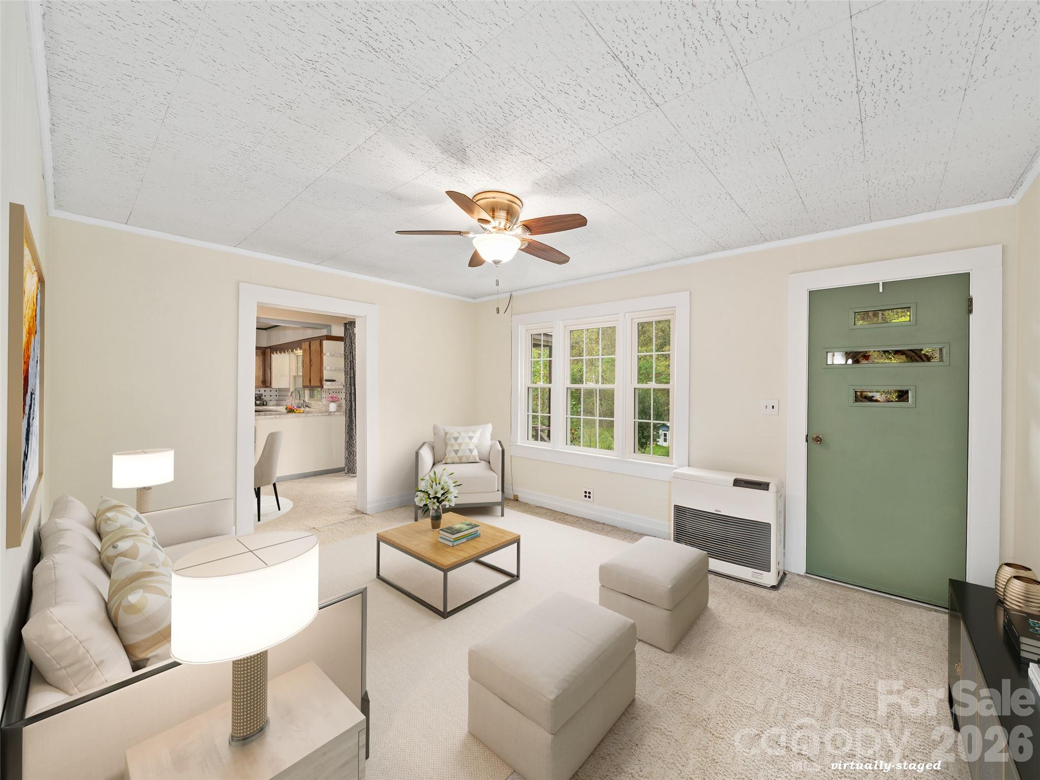 338 Sweet Creek Road Bakersville, NC 28705 - Photo 5 of 21 a living room with furniture and a large window