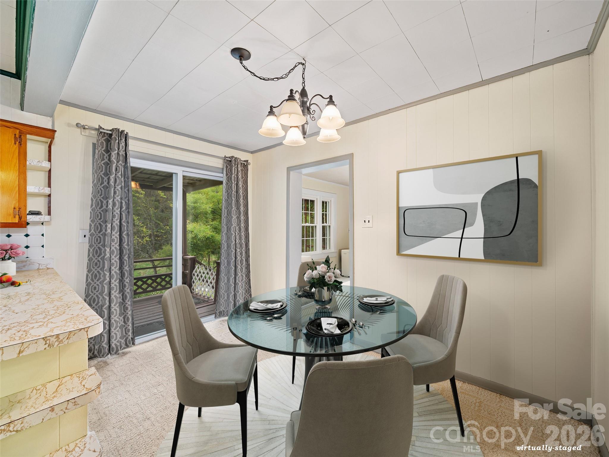 338 Sweet Creek Road Bakersville, NC 28705 - Photo 6 of 21 a view of a dining room with furniture window and outside view