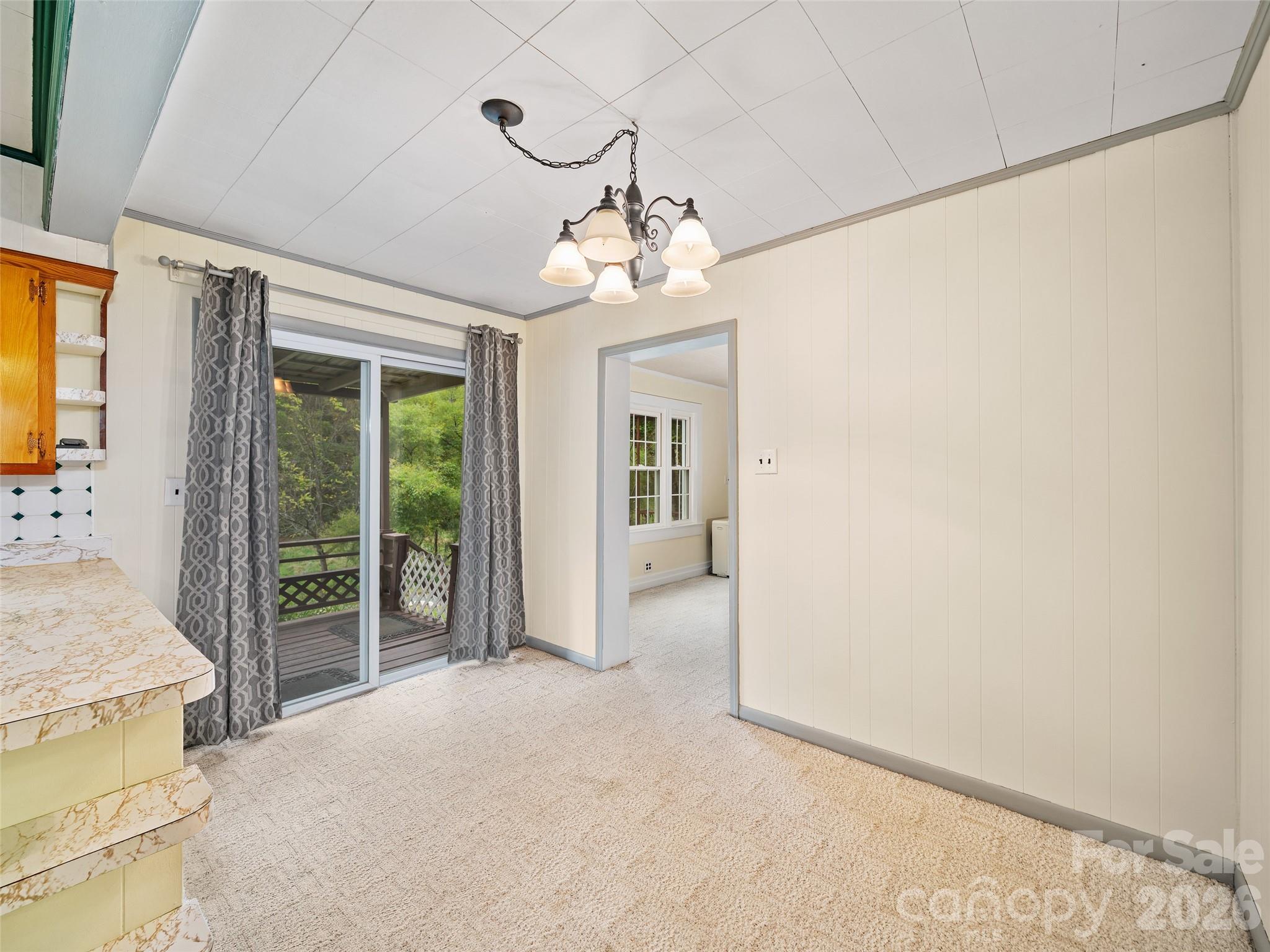 338 Sweet Creek Road Bakersville, NC 28705 - Photo 8 of 21 wooden floor in an empty room with a window