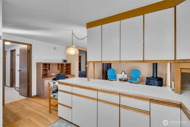 a kitchen with cabinets a sink and appliances