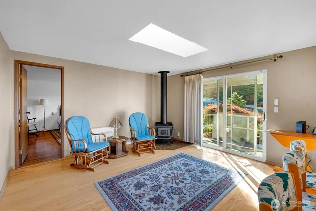 a living room with furniture rug and a table