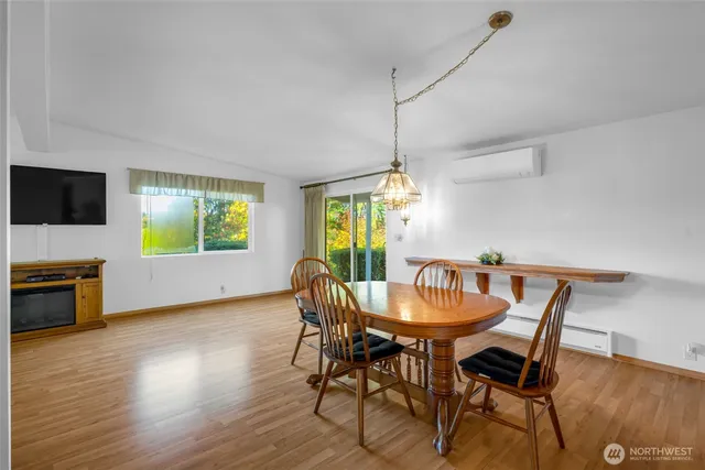 a dining room with furniture window wooden floor