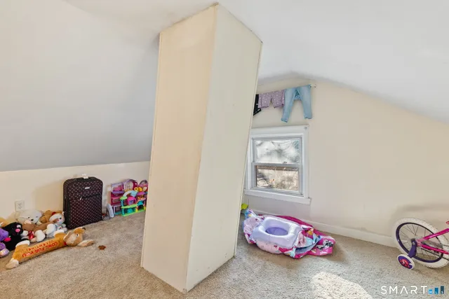 a bedroom with a bed and cabinets