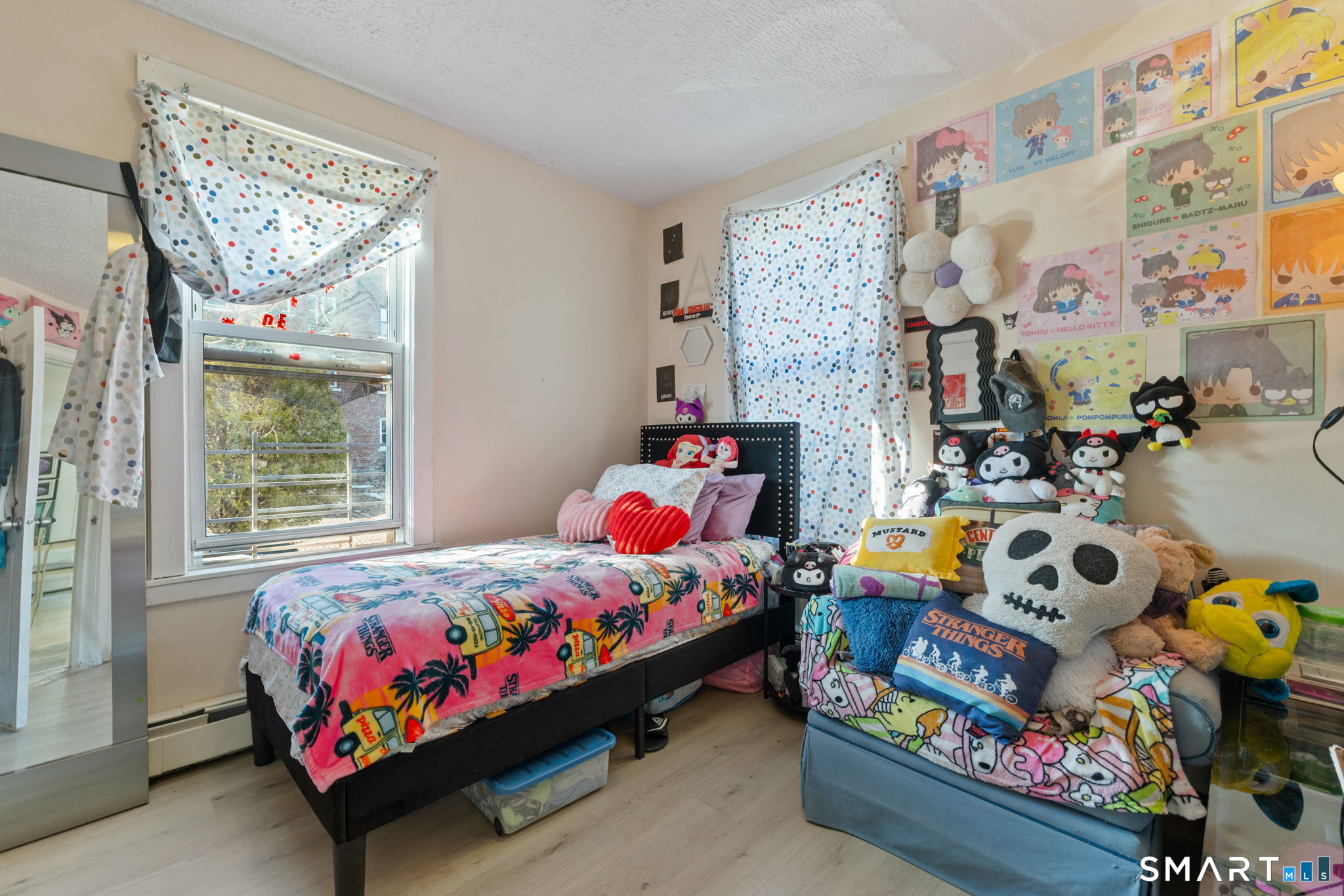 147 Martin Street Hartford, CT 06120 - Photo 23 of 34 a bedroom with baby bed and a window